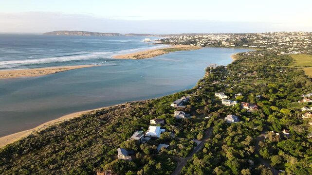 Underdeveloped lush banks of Keurbooms River estuary and golf course. Aerial