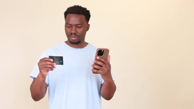 Frustrated black man experiencing problems with online payment, credit card error and mobile banking issues on his smartphone