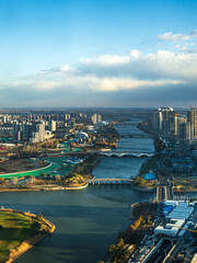 Obraz premium Aerial view of modern cityscape with a river flowing through Tongzhou, Beijing, China