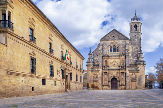View of Holy Chapel of the Saviour and Dean Ortega Palace in Ubeda, Spain. Renaissance architecture under cloudy sky at daytime