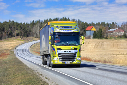New Yellow DAF XF 530 Truck Semi Trailer on Road. Copy Space.