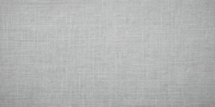 Natural rough gray and grey woven fabric material with a blank white linen canvas textile pattern and textured fiber cloth backdrop