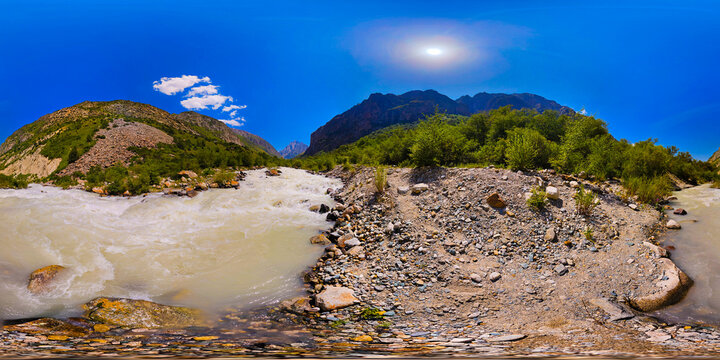 Fast-flowing muddy river in mountain valley equirectangular 360 panorama