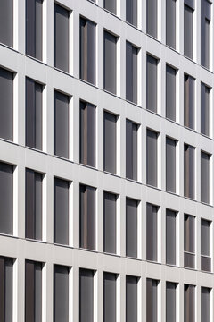 Abstract geometry pattern with symmetry on modern building facade architecture using minimalism as a refined background for corporate business branding and design