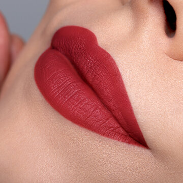 Red matte lipstick on lips macro close up bold beauty look
