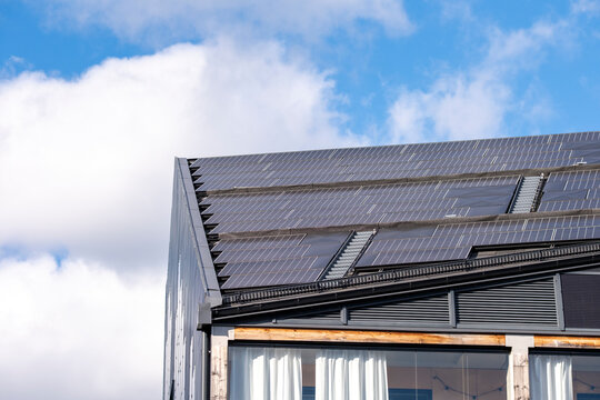 Sustainable scandinavia residential architecture uses photovoltaic solar roof technology to deliver renewable energy and modern efficiency in daylight