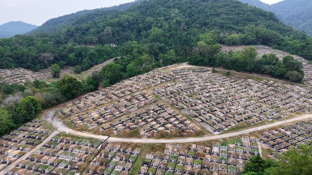 Aerial drone view of Teluk Bahang cemetery on hillside