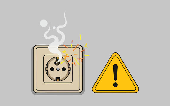 Smoking electrical outlet with warning hazard sign.