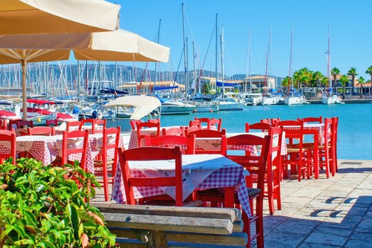 Lefkada Island, Greece. Typical greece tables and chairs in marina restaurant.