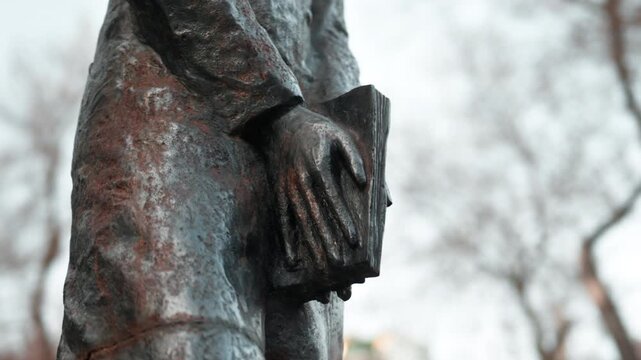 A statue of the Russian writer Alexander Sergeyevich Pushkin standing on the street close-up.