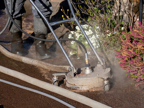 Hot Water Pressure Washer Cleaning Stone Patio Surface