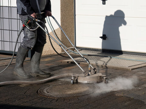 Hot Water Pressure Washer Cleaning Stone Patio Surface