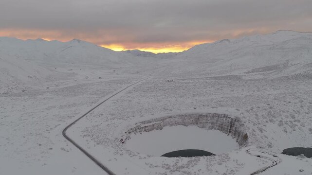 Scenic mountain road Ruta 222 crossing snowy Andes landscape at sunrise near Pozo de las Animas in Mendoza Argentina.