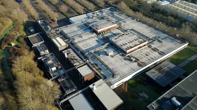 Straight down aerial view of the mechanical cooling systems and pipes on a modern technology building.