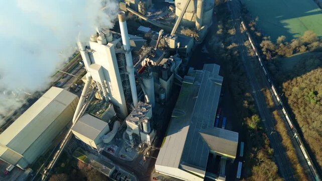 Drone shot following the line of smoke from an industrial chimney in Rugby.