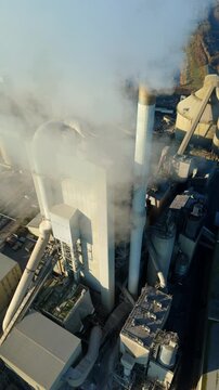 Close up aerial view of the conveyor systems and processing units at a UK cement production site.