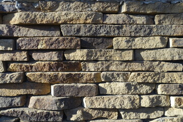 Naklejka premium Texture of rugged dry stack stone veneer wall