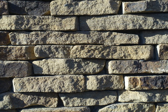 Texture of rugged dry stack stone veneer wall