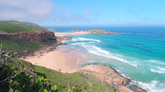 Scenic wild beach and blue ocean on headland coastline of Robberg Nature Reserve