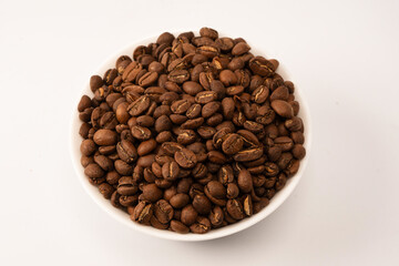 Obraz premium Coffee beans on a white background. Top view. Coffee beans texture.
