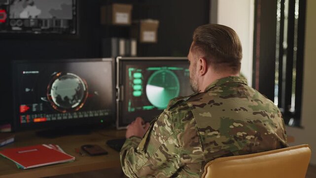 Ukrainian army officer planning military operation, reviewing satellite data