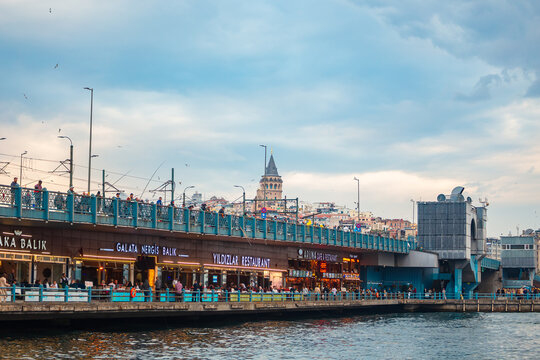 View of the Galata Tower and Galata Bridge. Evening Istanbul.