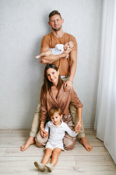 Parents And Children Smiling At Home