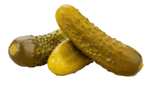 Green brined dill pickles stacked together, showing bumpy texture