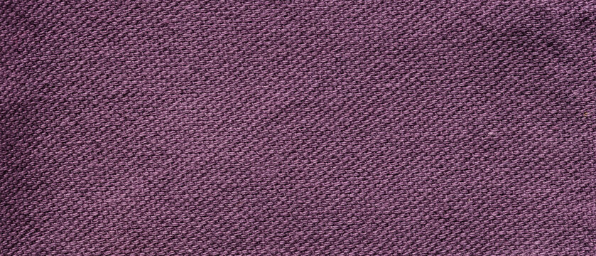 Purple mauve woven linen fabric texture with fine diagonal weave pattern as a background