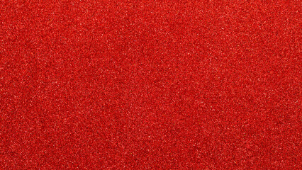 Naklejka premium Vibrant red glitter texture background with sparkling particles for festive design projects