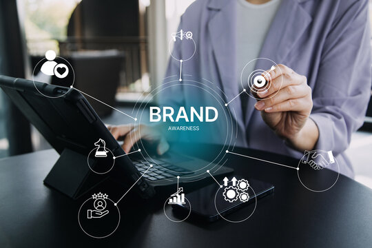 Brand awareness strategy concept, businessman touch digital brand awareness icons, communication, target, Marketing growth, customer loyalty, and partnership symbols for corporate branding success
