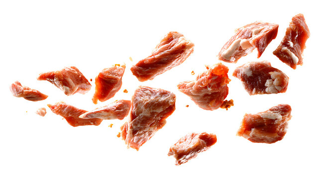 Cat food pieces of meat are flying isolated on a white background