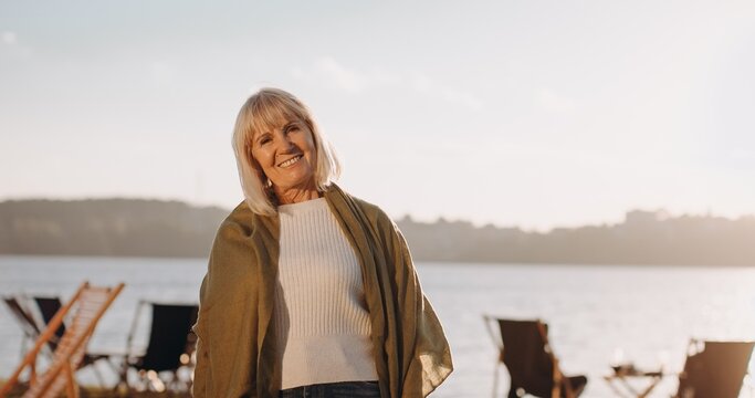 Happy senior woman confident enjoying nature smiling