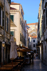Fototapeta premium Narrow Dubrovnik street with red roof old town view