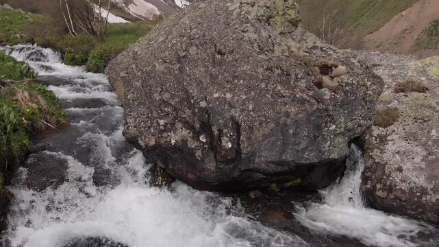Caucasus, North Ossetia. Adaykom Gorge. A fast-flowing mountain stream.