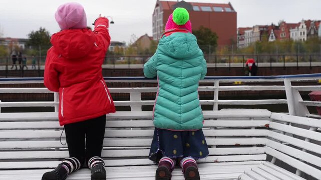Two sisters go on tourist boat on Vistula River