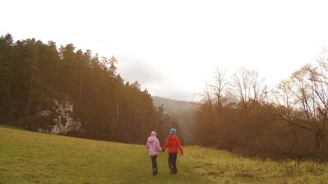 Two little beautiful girls walk in Slovak Paradise. Slovak Paradise (Slovensky raj) is mountain range in eastern Slovakia, part of Spis-Gemer Karst, located between towns of Spisska Nova Ves.
