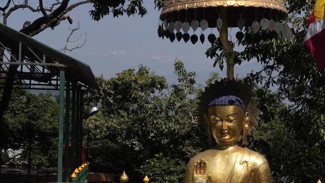 Golden Buddha Statue with Himalayan Mountains in the Background, Nepal