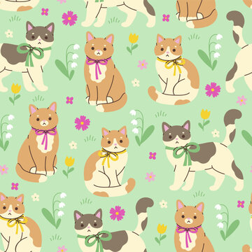 Seamless pattern with cute cats wearing bows and flowers. Vector graphics.