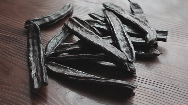 Close-up of Dried Carob Pods on Table