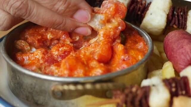 turkish menemen served with grilled skewers in a restaurant