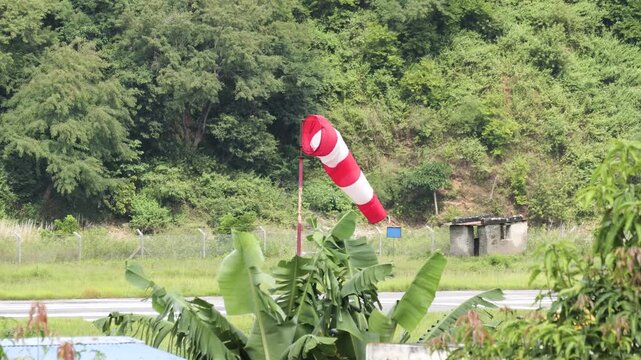 Red and White Windsock at a Remote Mountain Airport