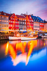 Obraz premium Copenhagen, Denmark. Colorful night water reflection of Nyhavn, Kobenhavn iconic canal.