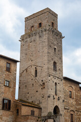 Naklejka premium Medieval stone tower dominating San Gimignano's historic skyline