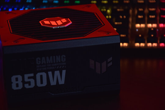 Computer AC power supply Asus Tuf 850w on a dark background.