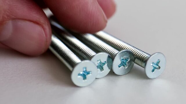 Flat Head Phillips Machine Screws on White Background Close Up
