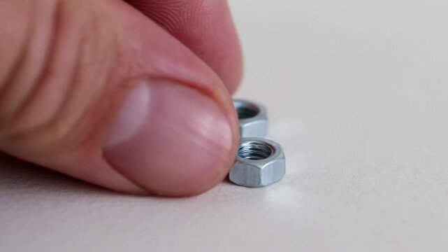 Hex Nuts on White Background Close Up Industrial Fastening Hardware