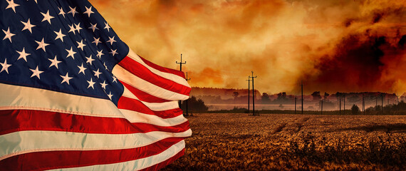 Naklejka premium Banner of American flag waving over rural field at dramatic sunset, power lines in background, patriotic landscape with warm tones and moody sky