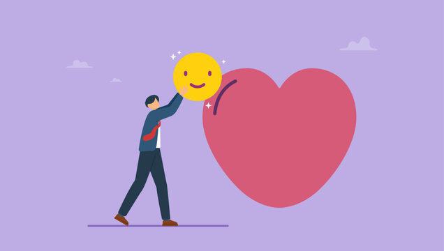 Businessman put emoticon smile in heart, giving a good mood. Help with mental problems, motivation, positive thinking, mental health concept.