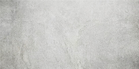 A textured concrete surface creates a subtle backdrop, revealing a weathered appearance that adds character and depth, evoking a sense of time. © DAKU MOHARAJ